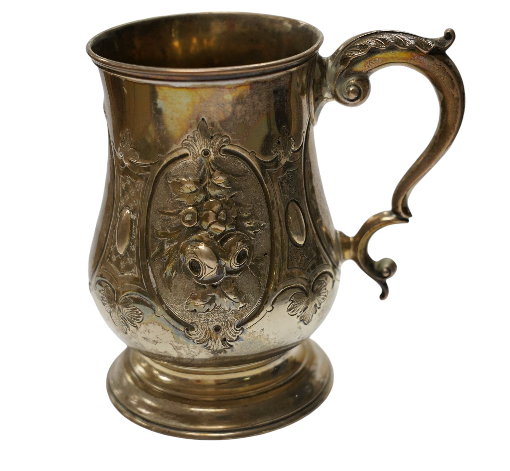 A Victorian repousse silver baluster mug, by Robert Harper, London, 1868, height 13.1cm, 8.9oz. Condition - fair